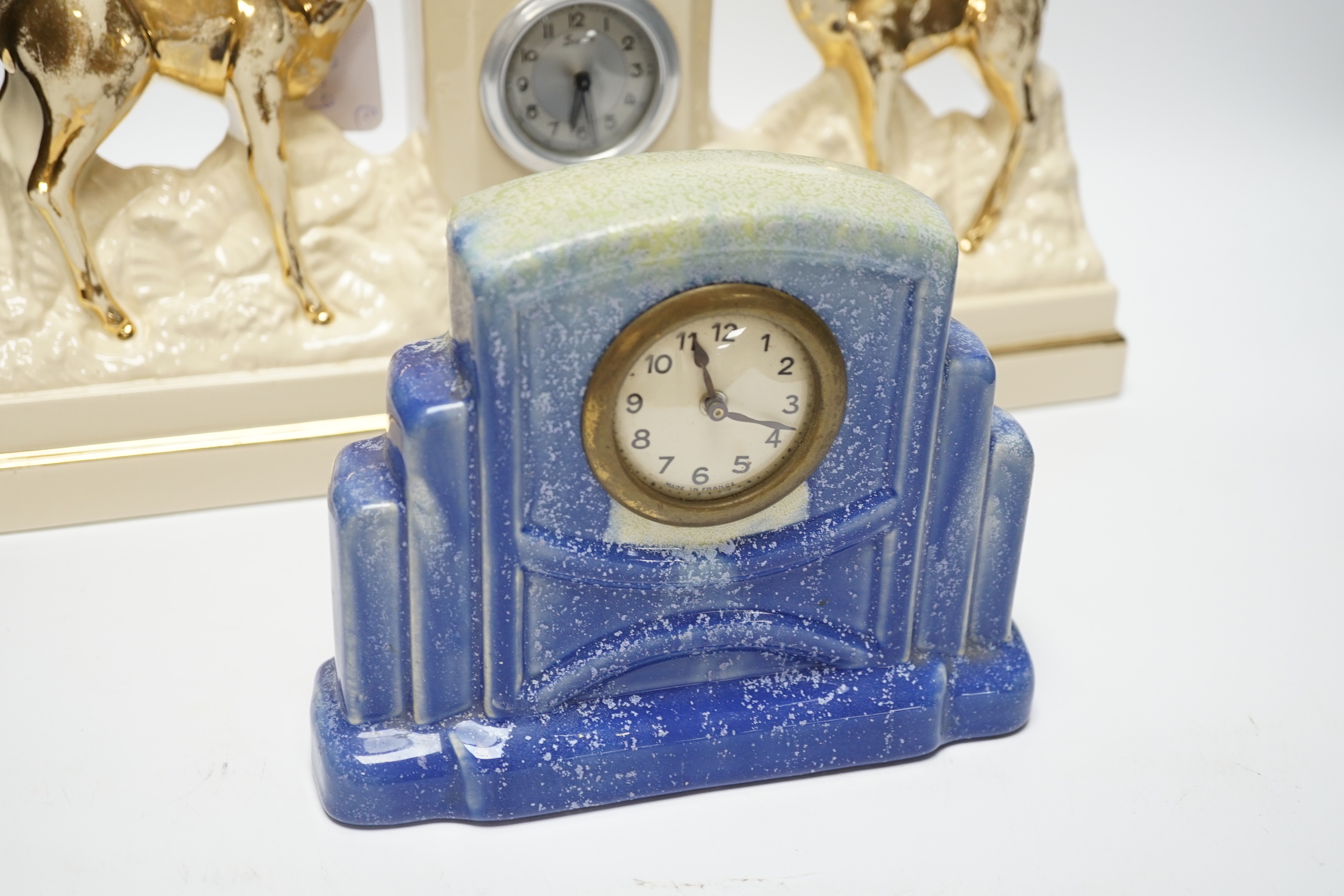 Two French ceramic mantel timepieces, largest 40cm wide